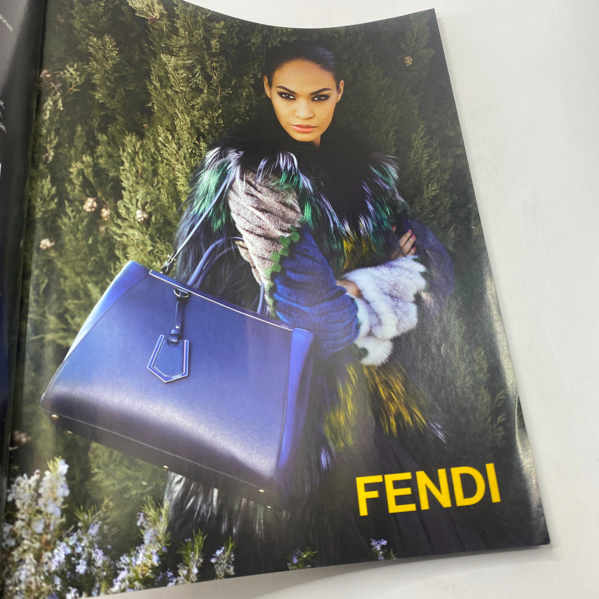 Fashion advertisement from Numéro Magazine August 2012 featuring a model styled in Fendi clothing, highlighting luxury and design.