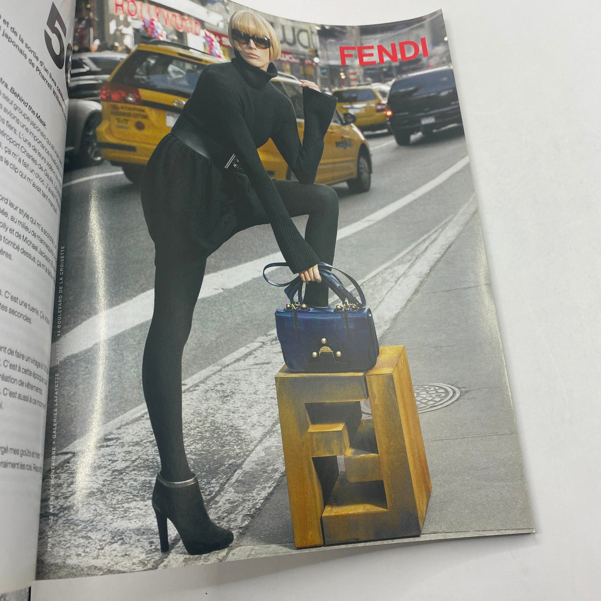 Numéro Magazine November 2008 No. 98 Naomi Campbell Cover featuring a stylish model in black attire posing on a street in New York City, showcasing a Fendi bag.