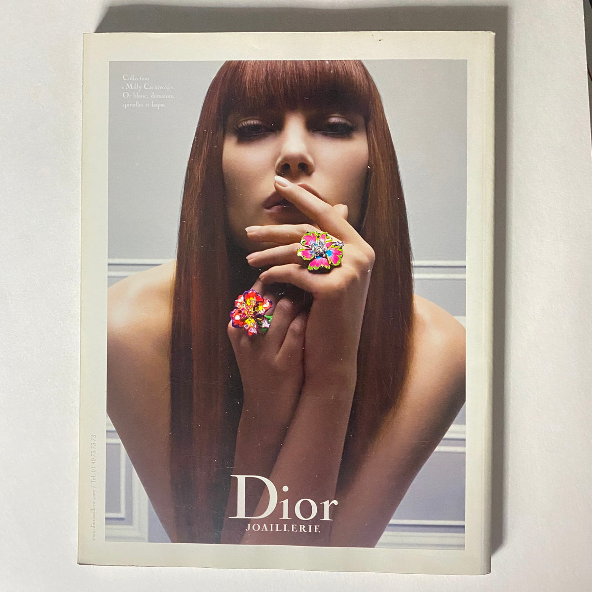 Numéro Magazine November 2008 No. 98 Naomi Campbell Cover depicting a model with long brown hair and vibrant floral rings, elegantly posing with a finger to her lips, representing Dior Joaillerie.