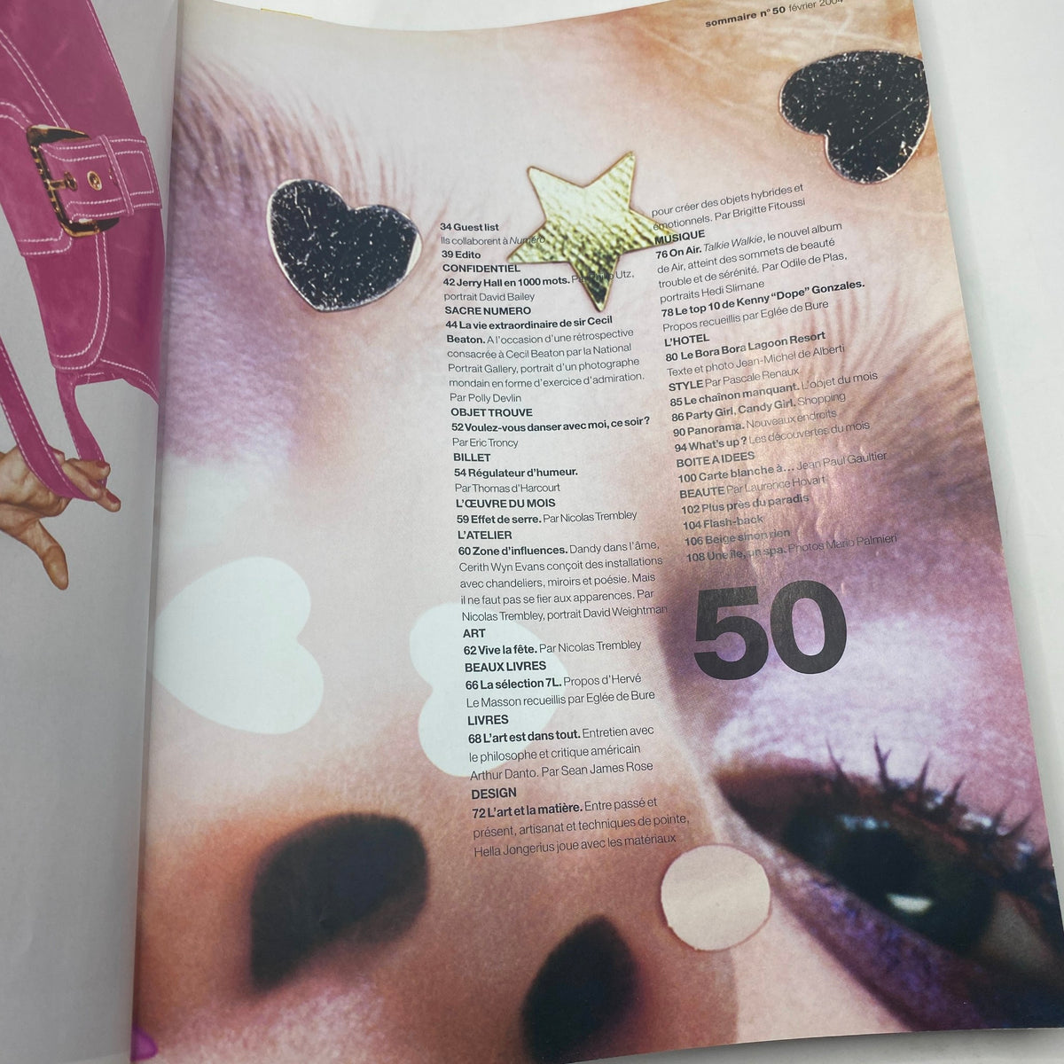 Inside page of Numéro Magazine February 2004 No. 50 featuring playful and artistic design elements, showcasing a blend of fashion and contemporary art.