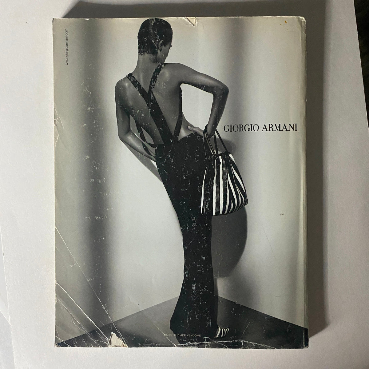 Cover of Numéro Magazine February 2004 No. 50 with a chic black and white photograph of a model styled in Giorgio Armani, exemplifying high fashion and vintage aesthetic.