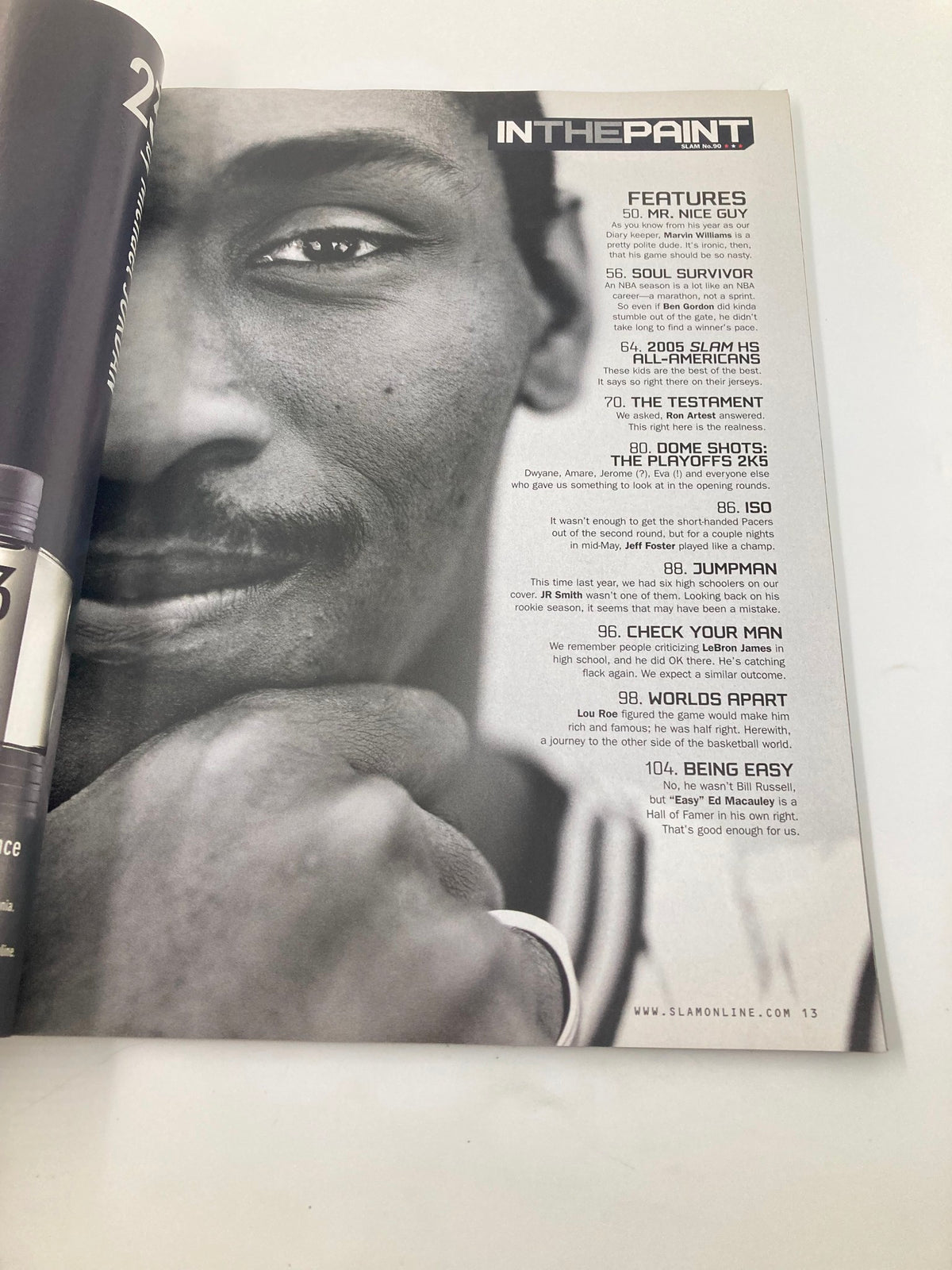 Inside page of Slam Magazine August 2005, featuring the 'IN THE PAINT' section with a close-up black and white image of Ron Artest, reflecting the magazine's focus on basketball culture and personalities.