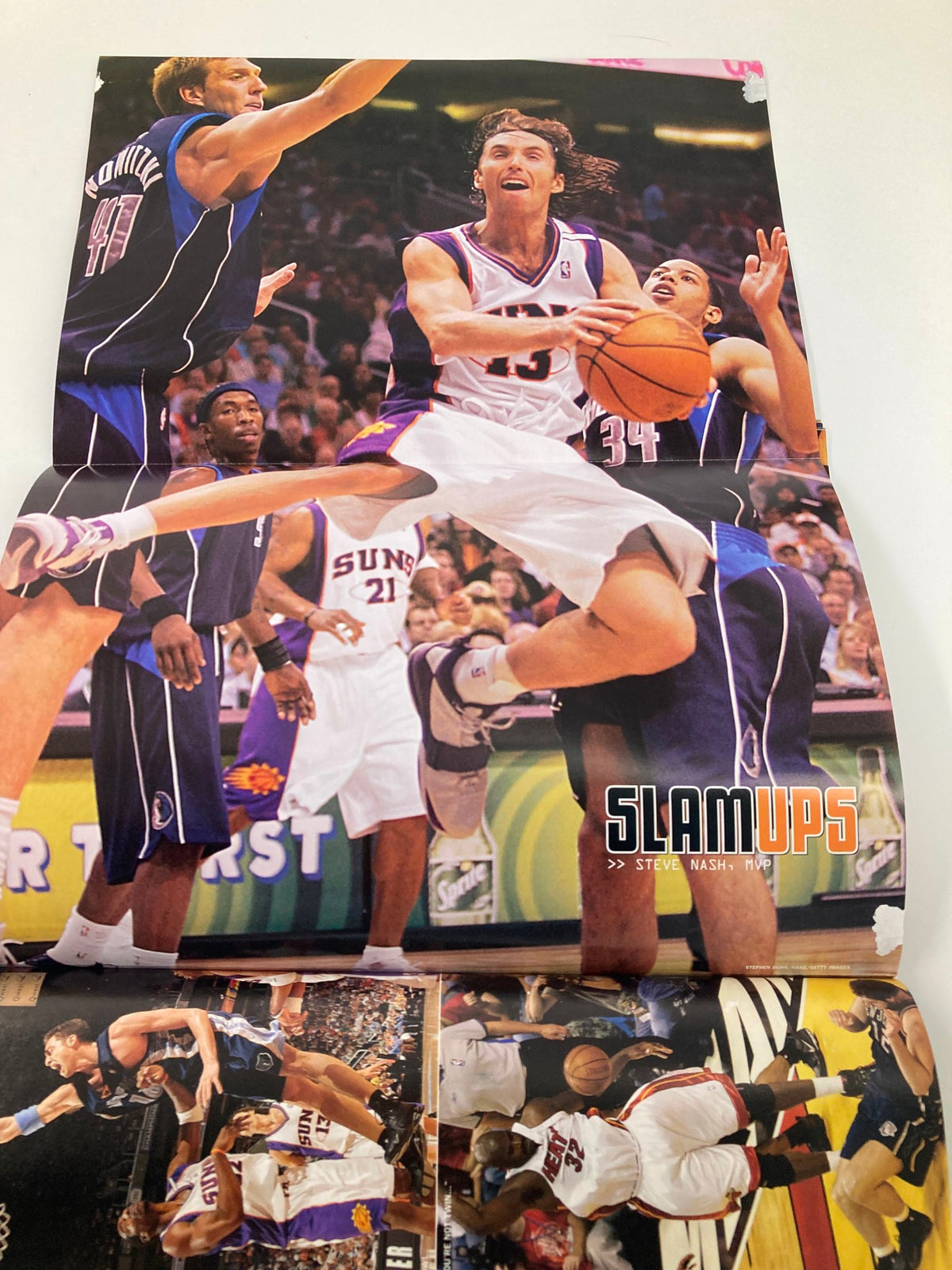 A poster included in Slam Magazine August 2005, featuring high-action basketball moments with multiple players, enhancing the collectible nature of the magazine associated with Ron Artest.
