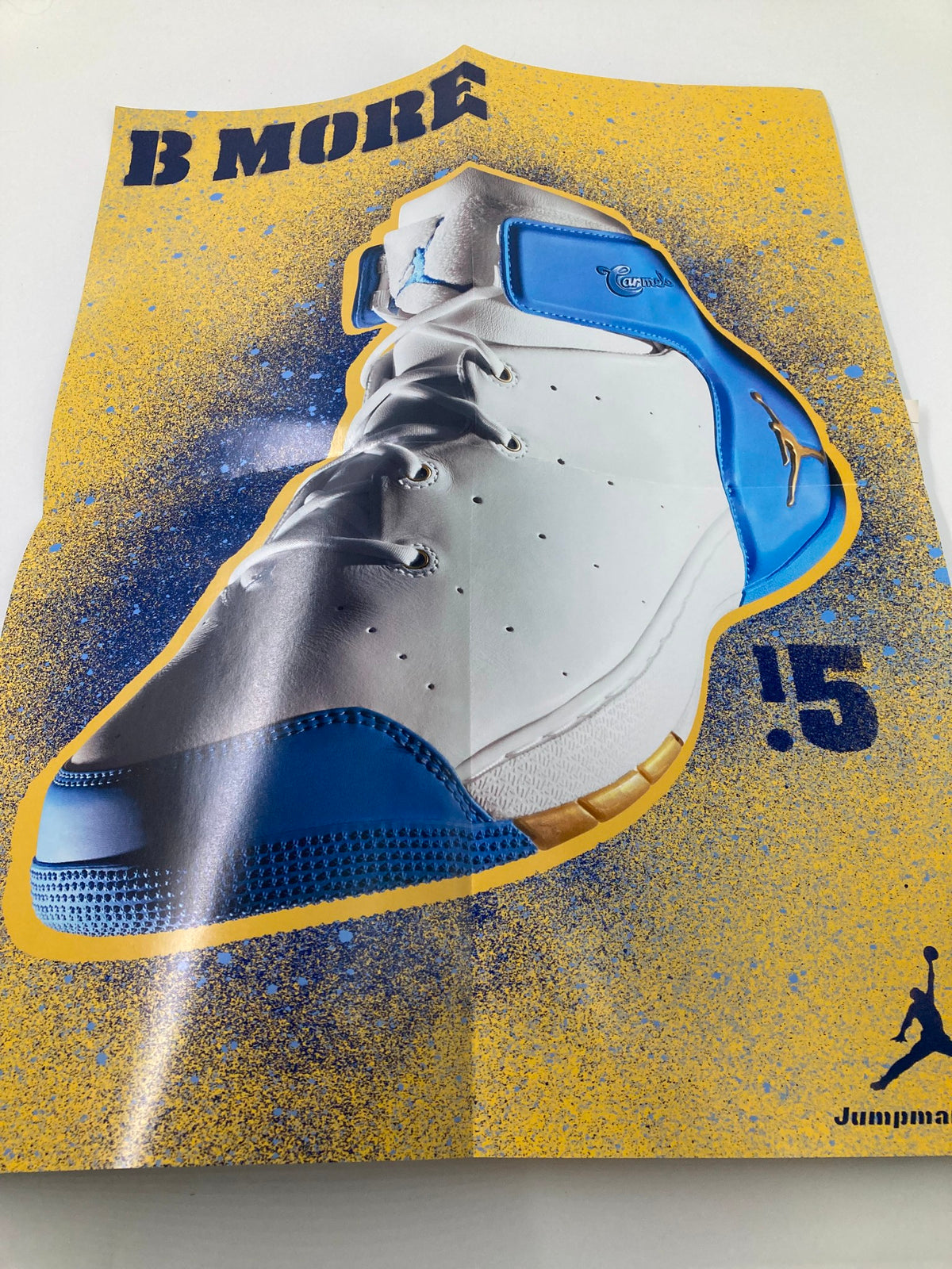 Slam Magazine February 2005 poster highlighting a stylish basketball shoe in a bold color scheme, representing sports fashion.
