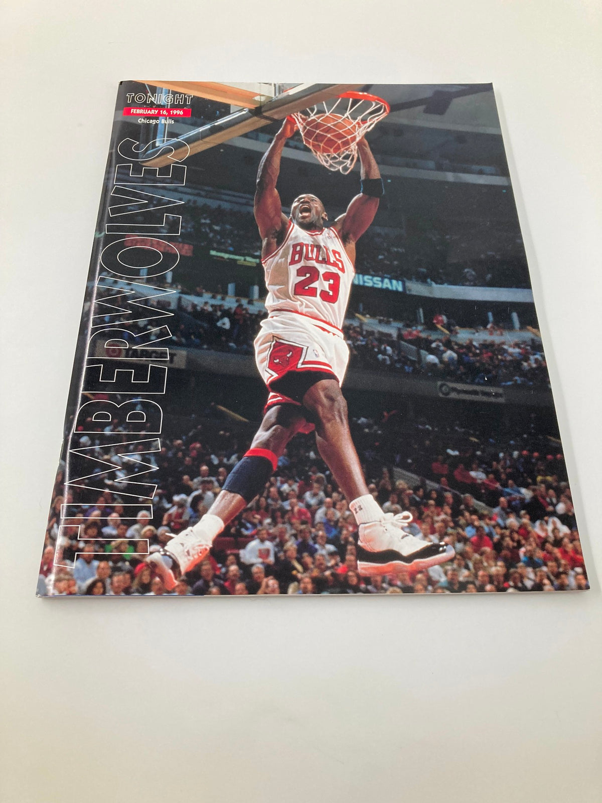 Timberwolves Tonight Magazine February 16, 1996 cover with Michael Jordan of the Chicago Bulls executing a dunk, highlighting the competitive spirit of 90s NBA basketball.