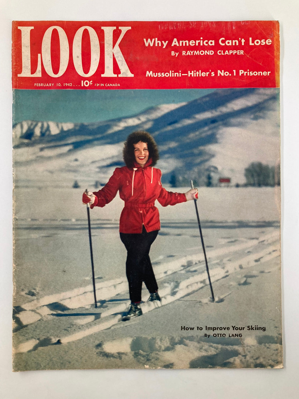 VTG Look Magazine Cover - February 10, 1942 featuring Elyse Knox, dressed in red, skiing in a snowy landscape, reflecting the charm of the early 1940s.