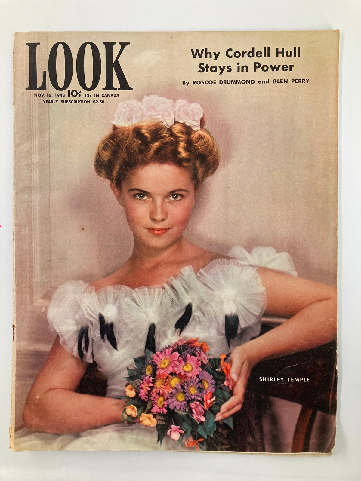 Cover of VTG Look Magazine from November 16, 1943 featuring Shirley Temple, showcasing her ladylike appearance with a bouquet of flowers.