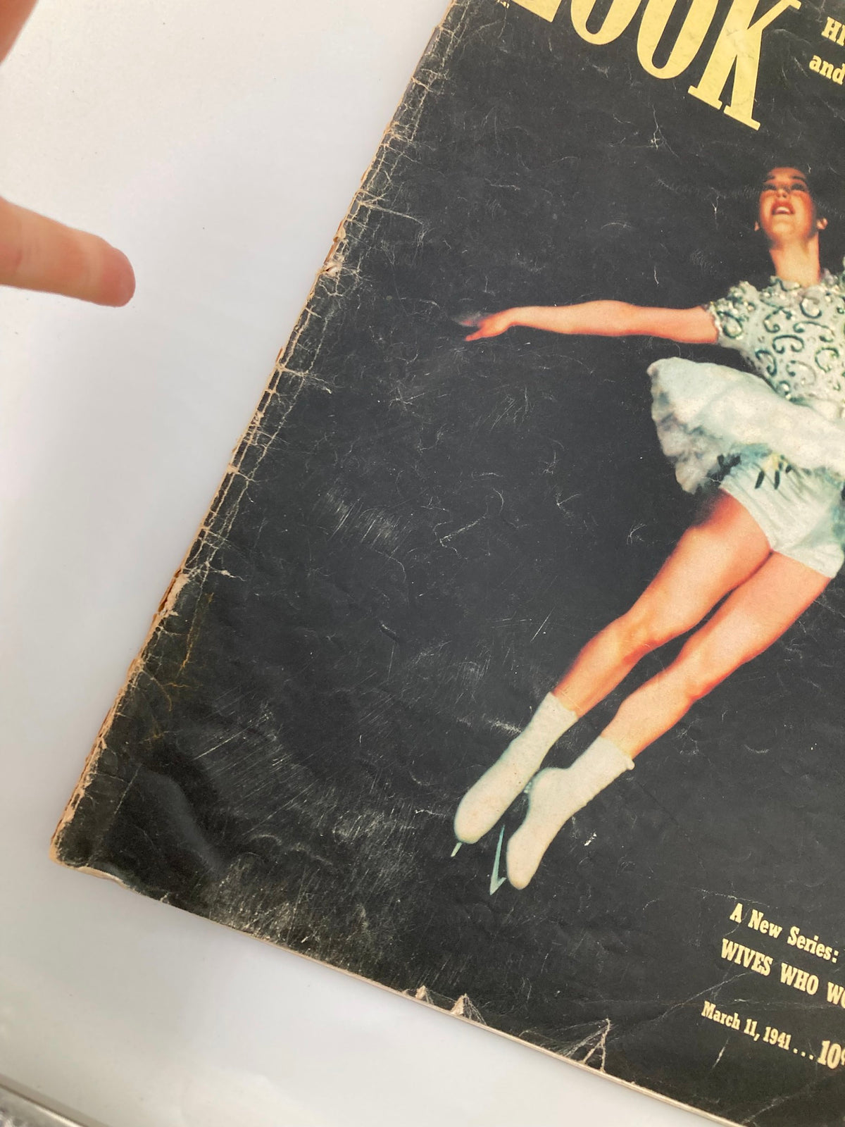 Close-up view of the cover of Vintage Look Magazine March 11, 1941 highlighting the main headline and a female figure skater in motion.