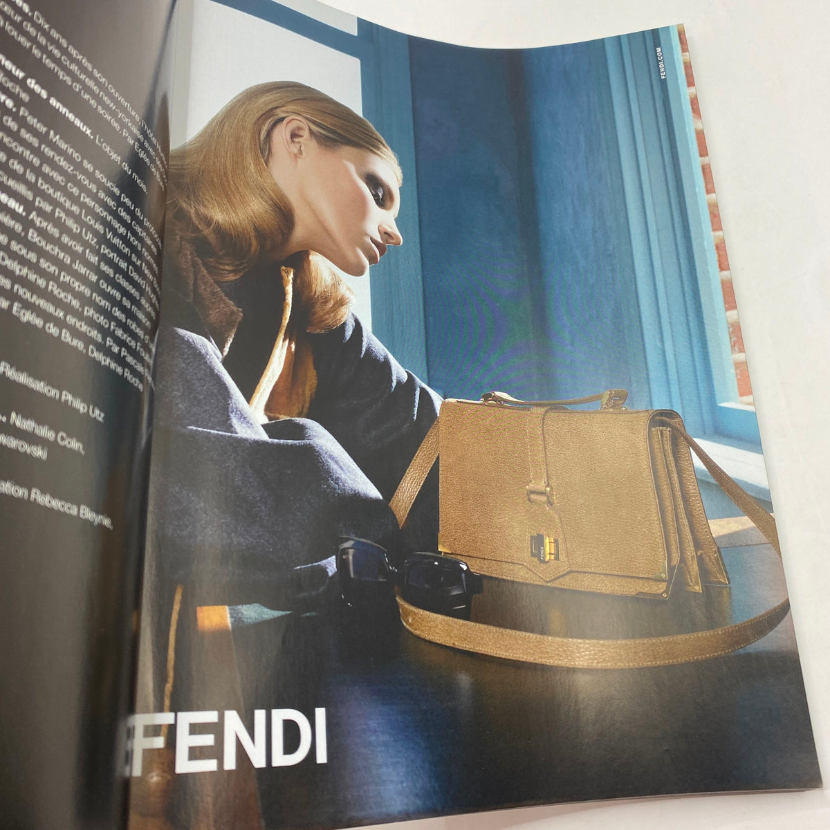 Fendi advertisement from Numéro Magazine September 2010 No. 116, featuring a model with a stylish handbag.