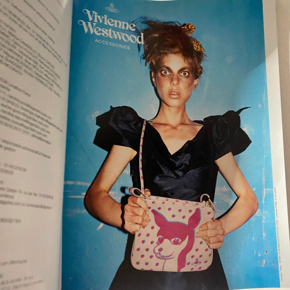 Interior page of Numéro Magazine March 2010 No. 111 highlighting Vivienne Westwood accessories, with a model in a stylish black dress holding a playful accessory bag.