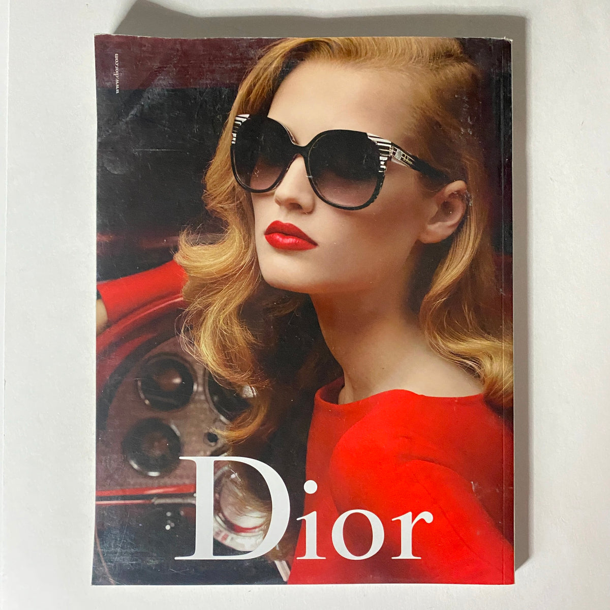 10 Magazine Winter 2009 cover featuring a glamorous model wearing oversized sunglasses and bold red lipstick, embodying high fashion aesthetics and sophisticated style.