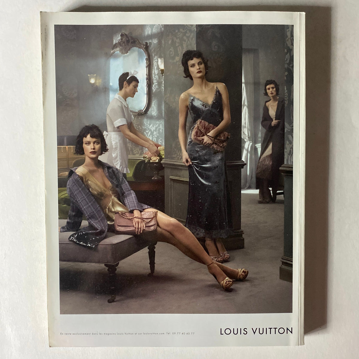 Vogue Paris Magazine September 2013 Cover displaying a Louis Vuitton advertisement, featuring models in luxurious evening wear in a stylish setting.