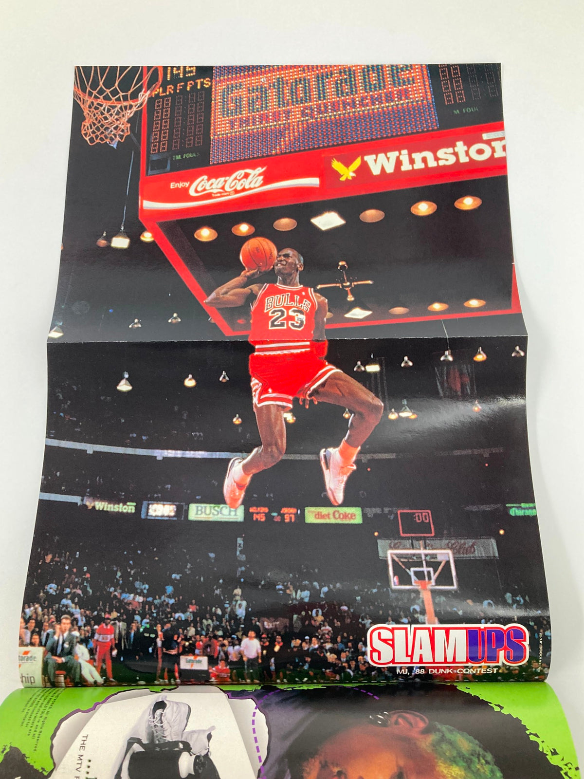 Slam Magazine August 1997 exclusive poster of Michael Jordan dunking, representing his iconic style and influence on basketball culture during the 1990s.