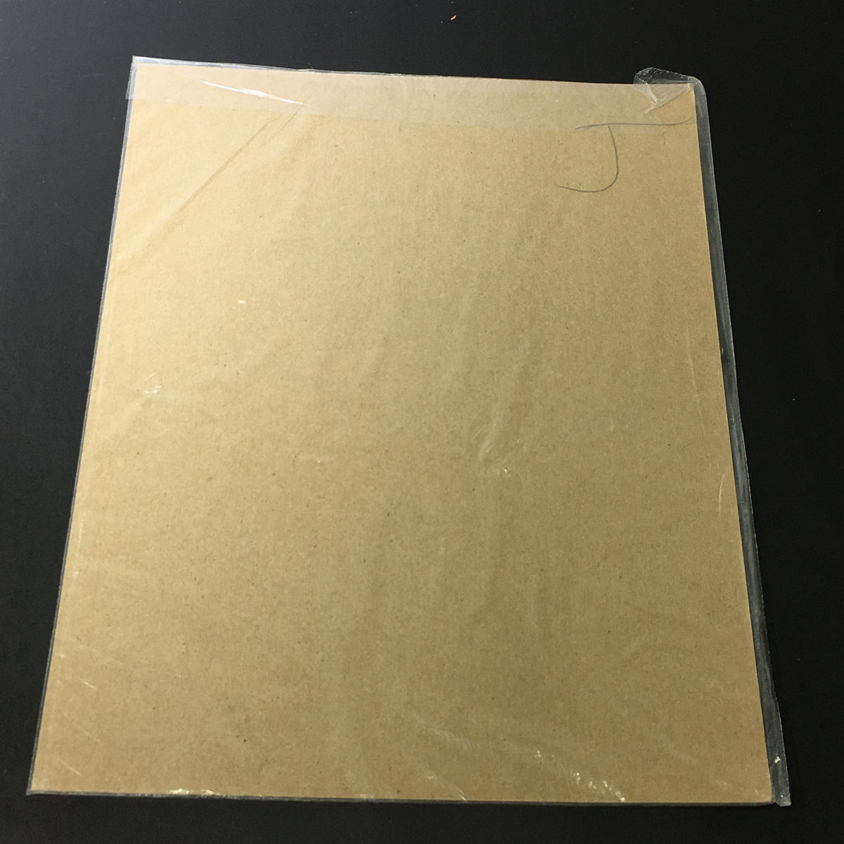 Back view of VTG April 7 1934 United States Rubber Company Tempered Rubber Miles Print Ad, showing protective packaging and backing for preservation.
