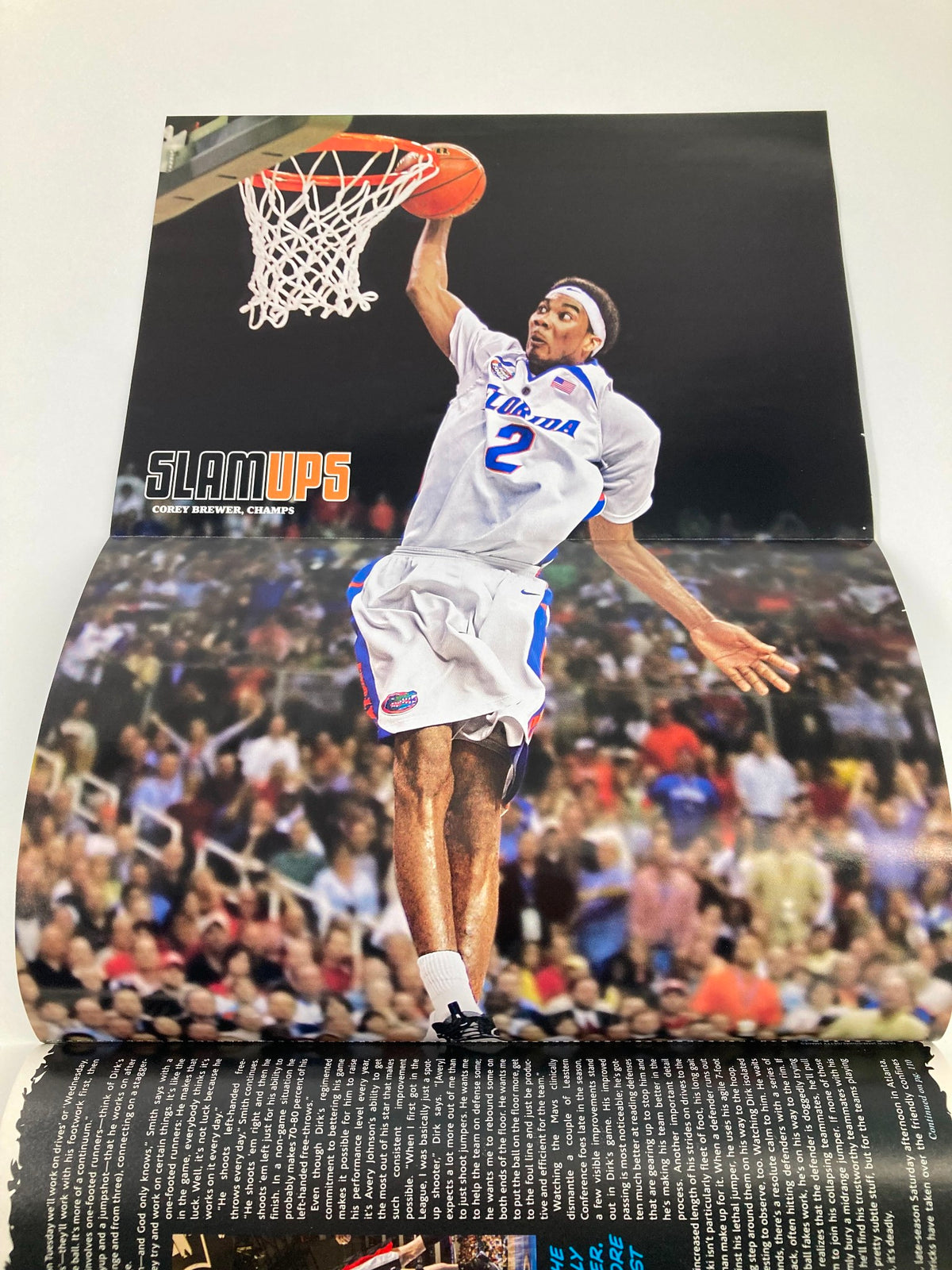 Double-page spread poster from Slam Magazine July 2007 depicting an action shot of an athlete dunking a basketball, celebrating the vibrancy of the sport.