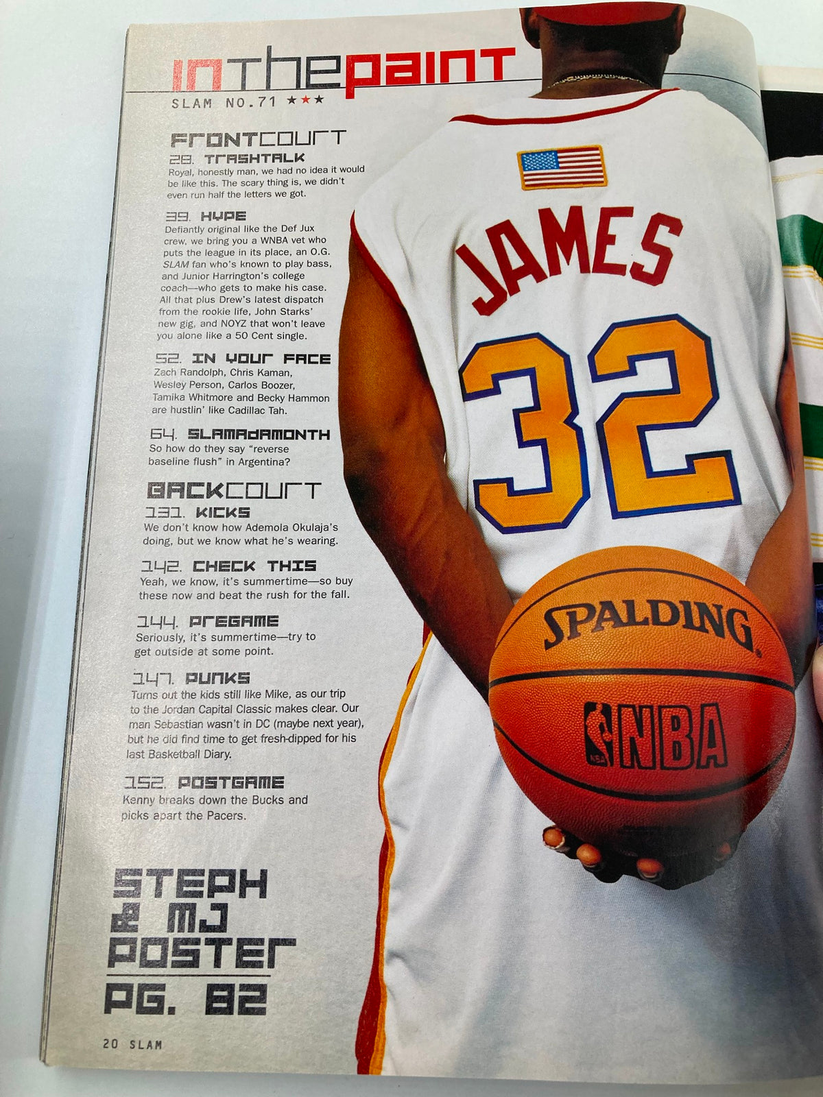 Slam Magazine August 2003 featuring LeBron James, showcasing the player's iconic jersey and a basketball, part of an article titled 'In The Paint'.