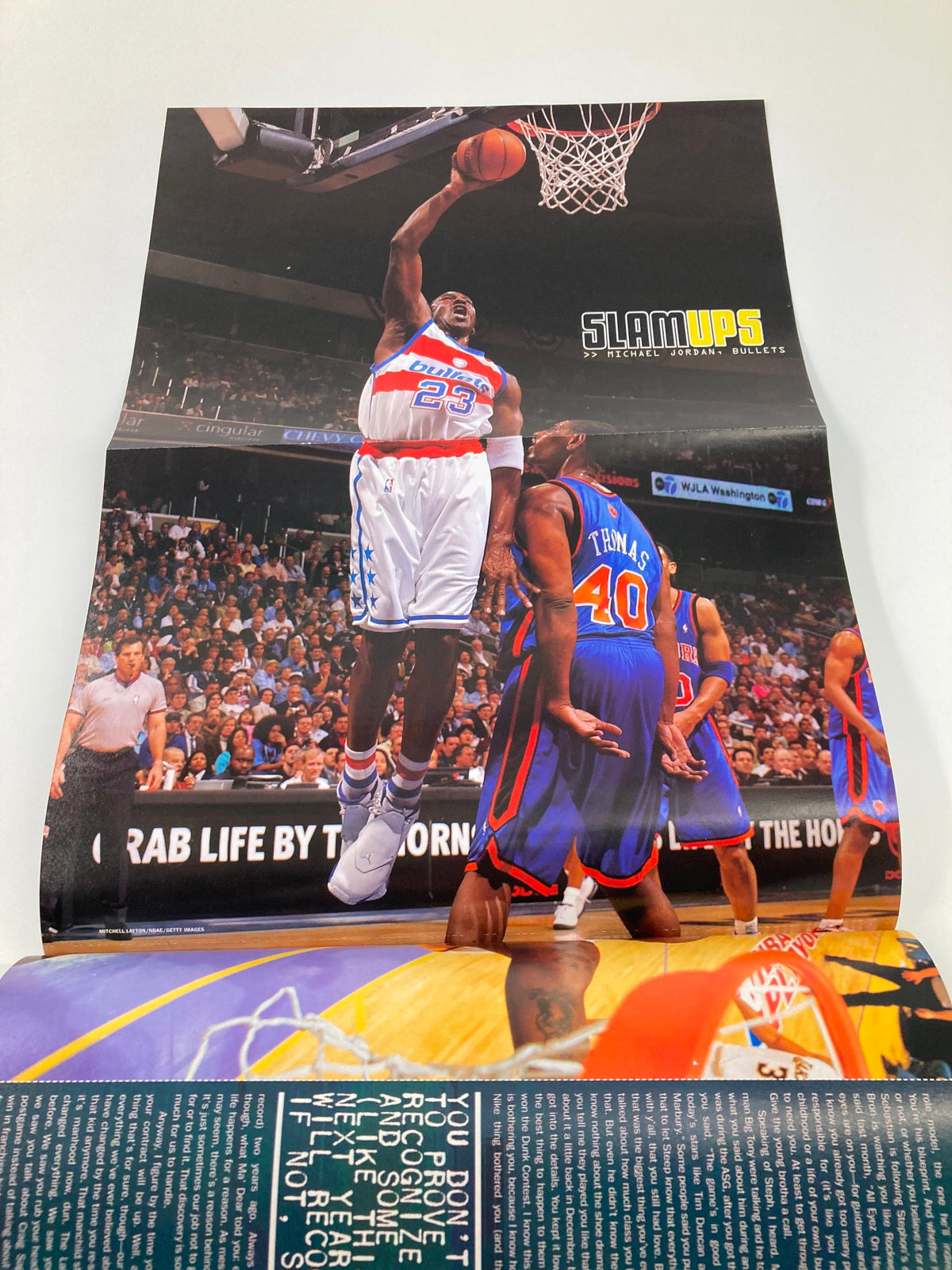 Slam Magazine August 2003 featuring LeBron James, with an action-packed poster of LeBron James making a slam dunk during a game.