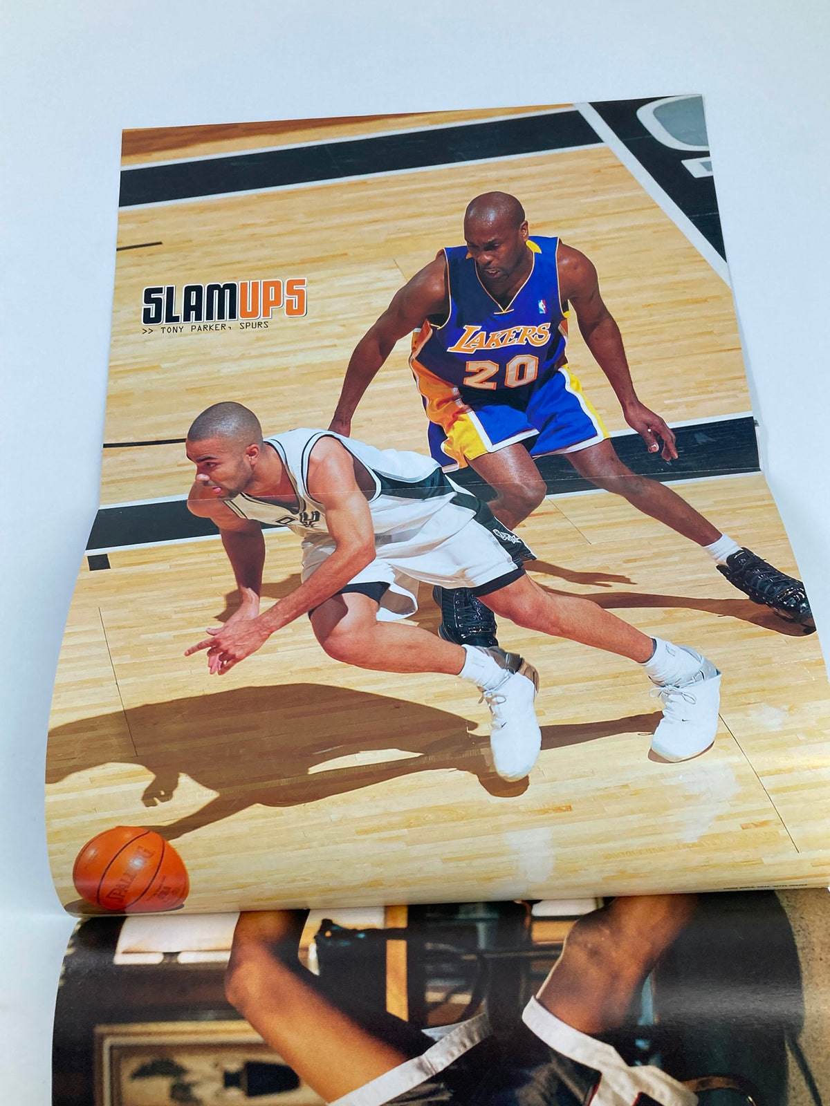 Slam Magazine August 2004 issue featuring Dwight Howard and Shaun Livingston, showcasing a dynamic image of a basketball player in action on the court.