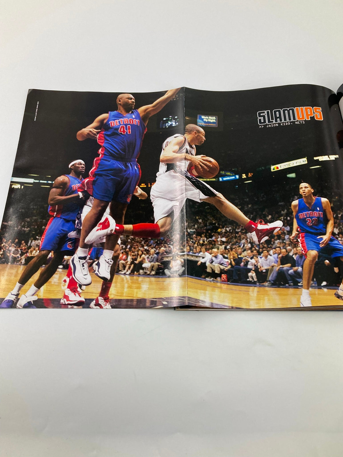 Slam Magazine August 2004, capturing an exciting moment in basketball with players in action, highlighting the energy of NBA games and the iconic poster inclusion.