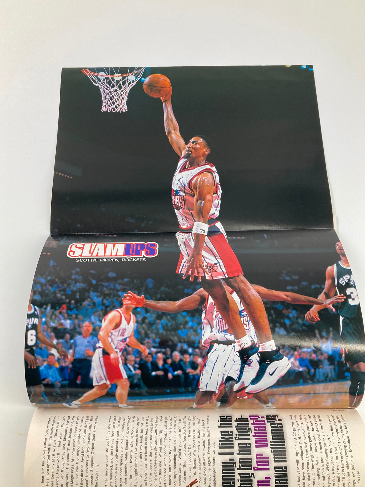 Fold-out poster section from Slam Magazine June 1999 showcasing Scottie Pippen of the Houston Rockets performing a slam dunk, capturing the excitement of 90s basketball.