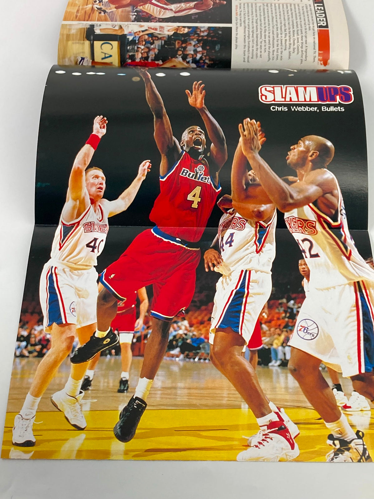 Slam Magazine March 1997 pages showcasing Chris Webber in action with the Bullets during a key play against the 76ers.