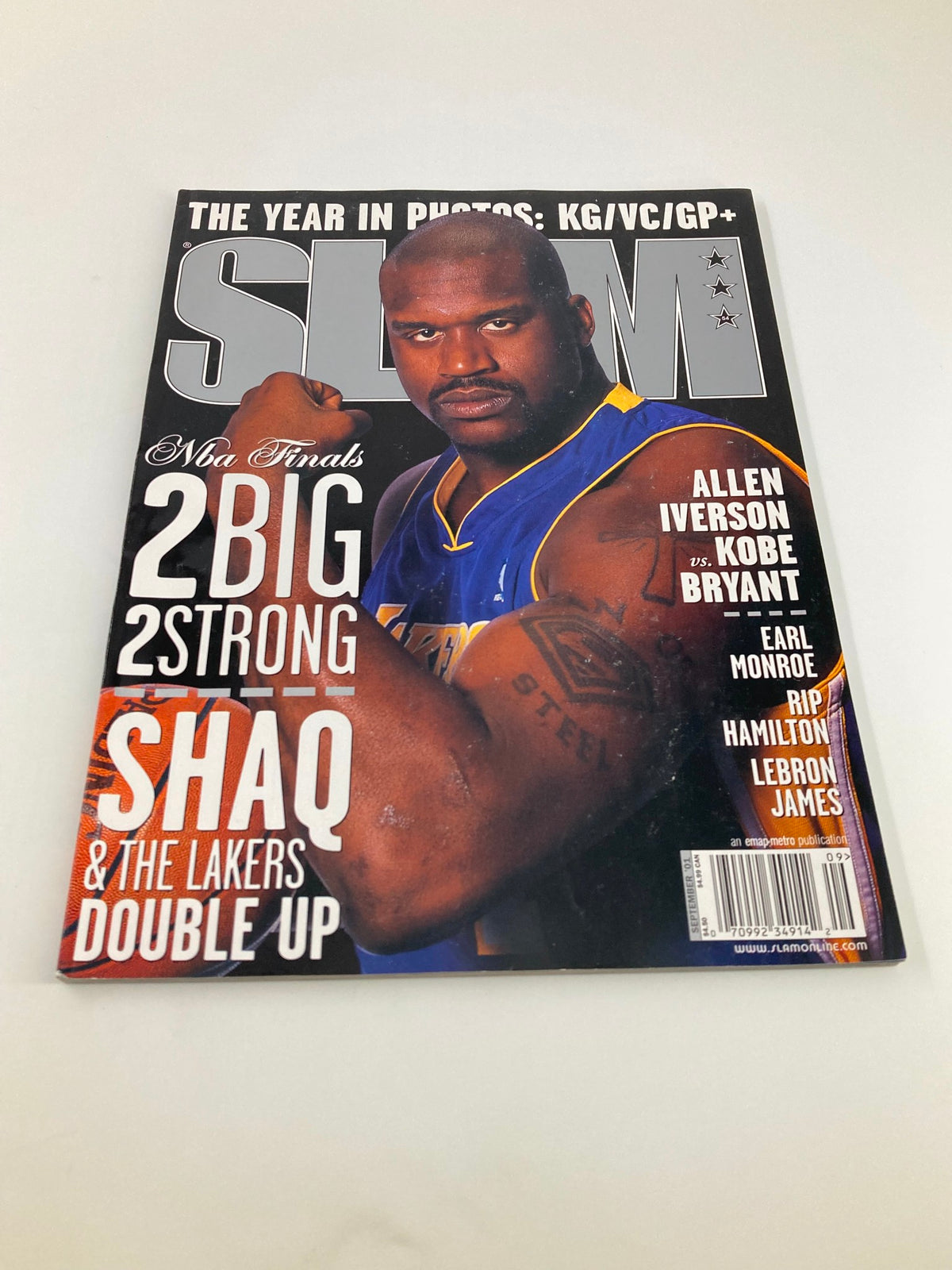 Alternate angle of the cover of Slam Magazine September 2001 showing Shaquille O'Neal flexing, emphasizing his athletic physique and the magazine's bold headlines.