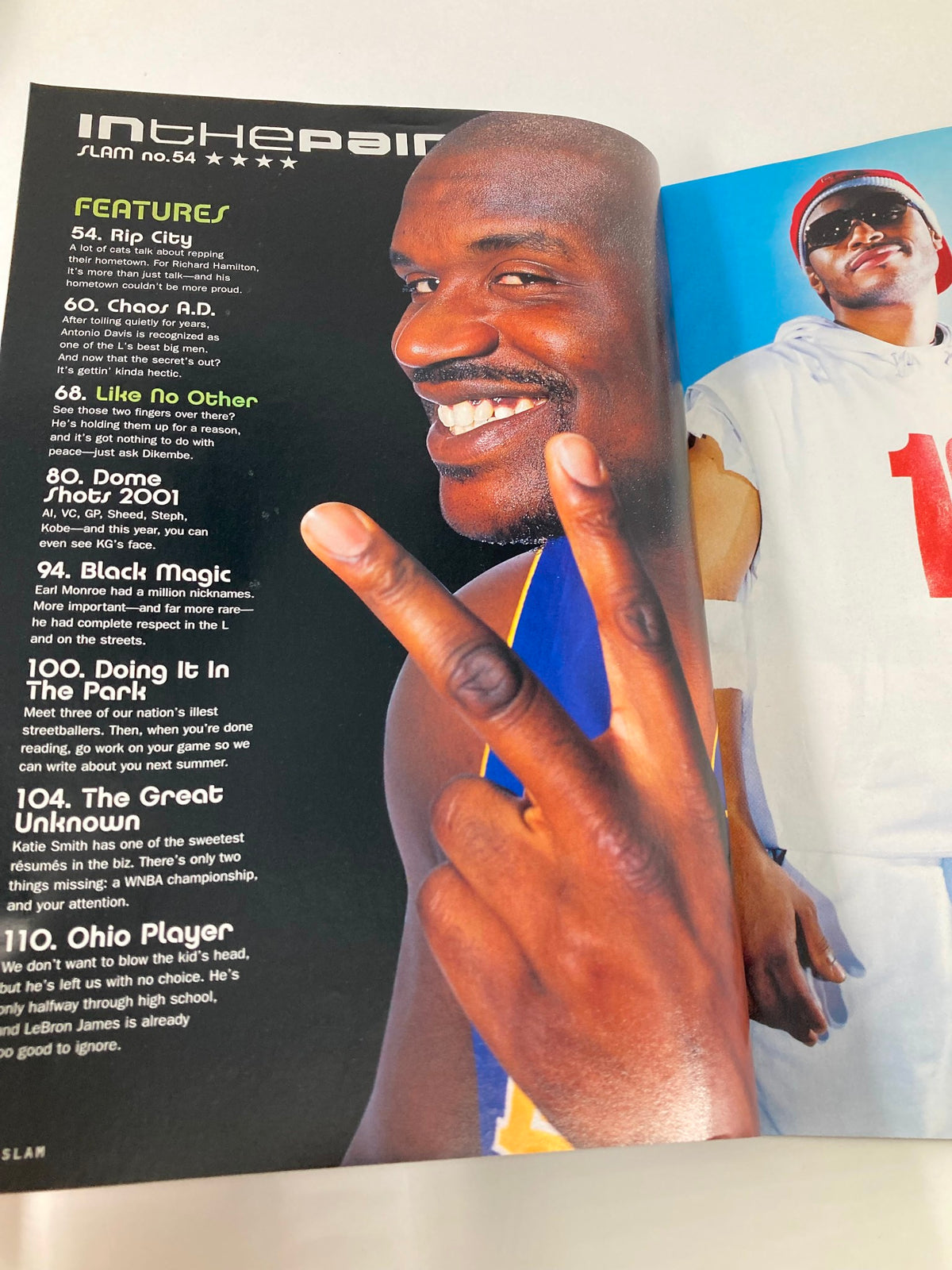 Inside page of Slam Magazine September 2001 with Shaquille O'Neal flashing a peace sign, featuring articles on NBA culture and highlights.