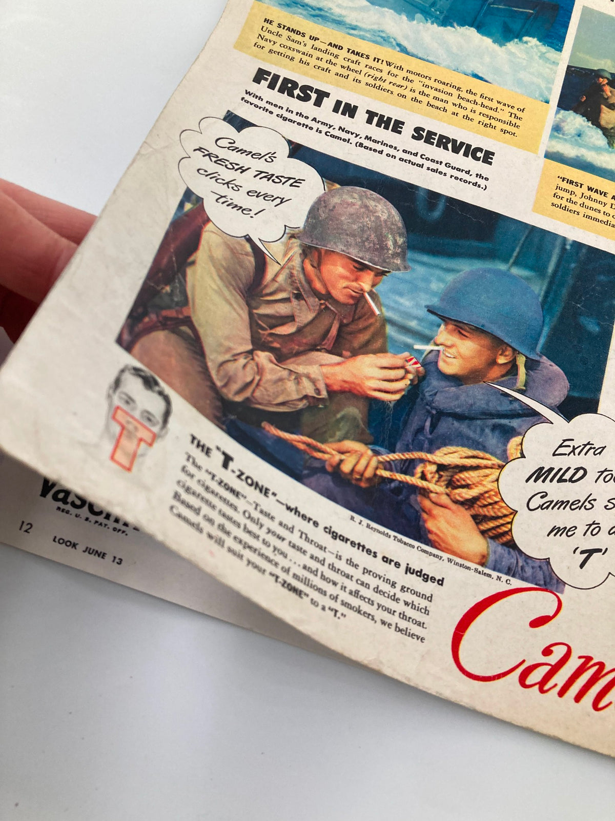 Close-up of an advertisement in the VTG Look Magazine June 13, 1944, featuring soldiers in the service promoting Camel cigarettes, showcasing wartime marketing and cultural influences of the 1940s.