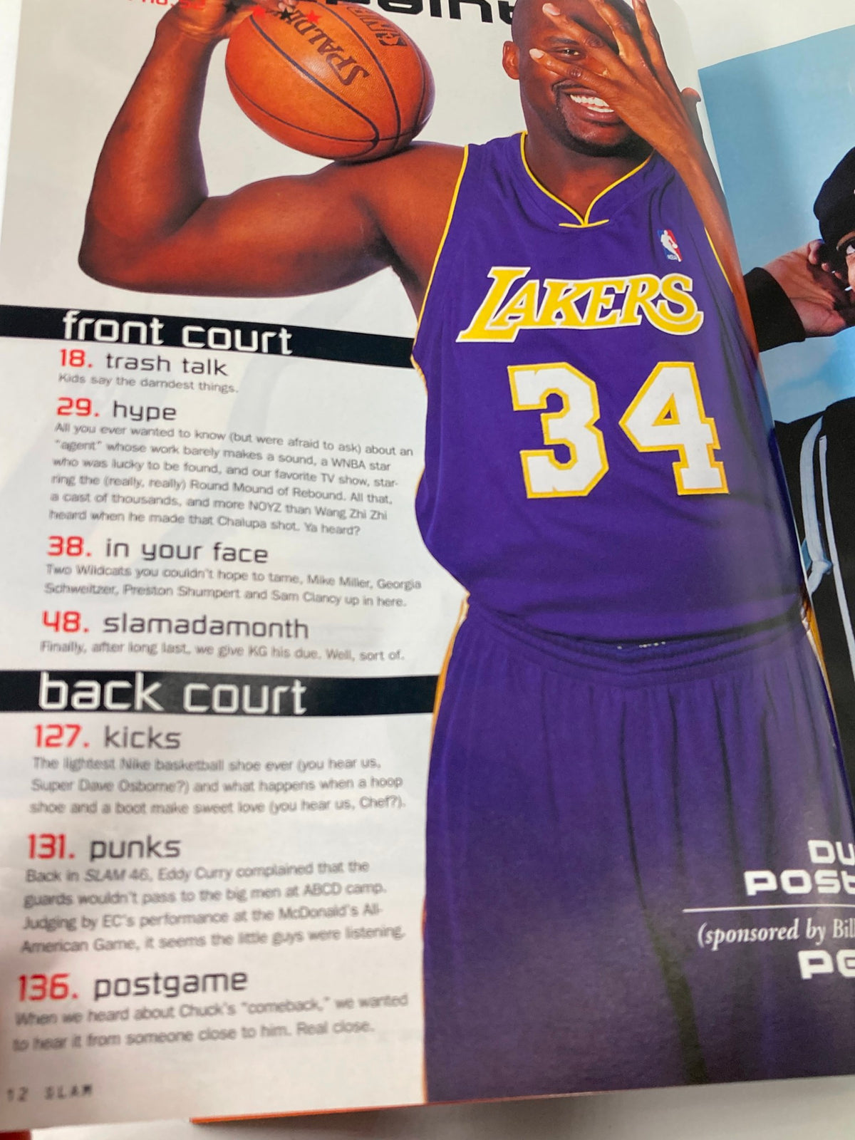Slam Magazine June 2001 featuring Shaquille O'Neal in Lakers jersey, showcasing dynamic basketball action.