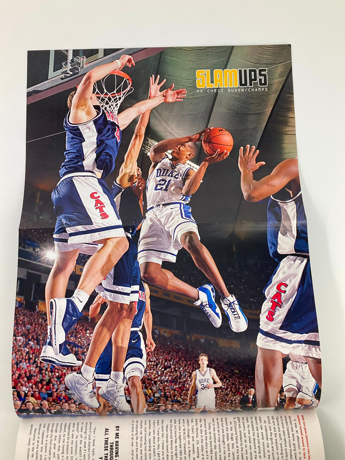 Slam Magazine June 2001 poster featuring a high-flying basketball player in mid-air action during a game.