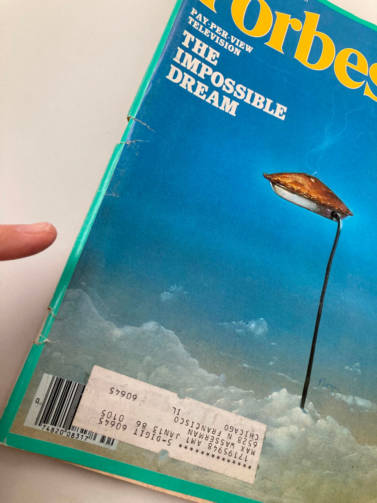 Close-up view of the VTG Forbes Magazine cover from August 26, 1985, showcasing the title 'Pay-Per-View Television: The Impossible Dream'. Visible wear includes a label and creases.