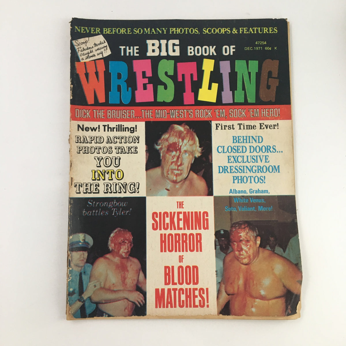 Cover of The Big Book of Wrestling, December 1971 edition featuring bold colors and text, advertising articles on wrestling stars Dick the Bruiser and exclusive behind-the-scenes photos.
