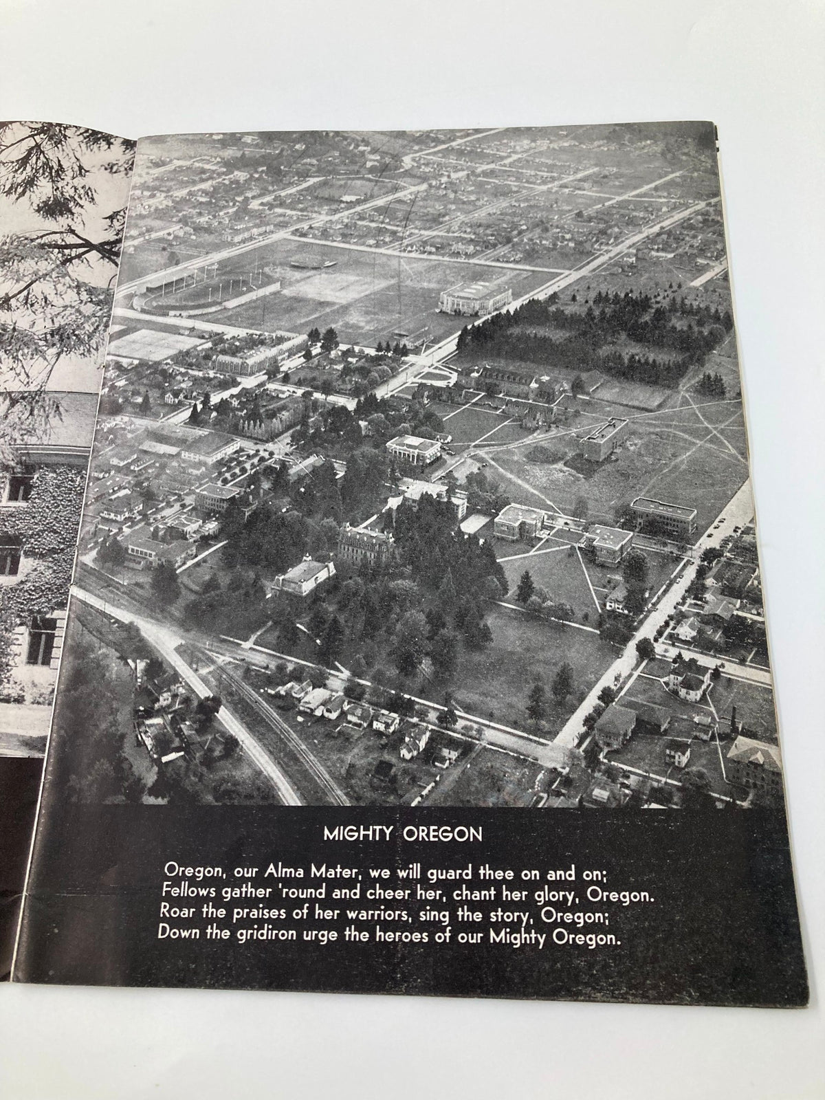 Page inside the 1931 NCAA Football Oregon Ducks vs Saint Mary's Gaels Official Program displaying a black and white aerial view of the Oregon campus with text titled 'Mighty Oregon'.