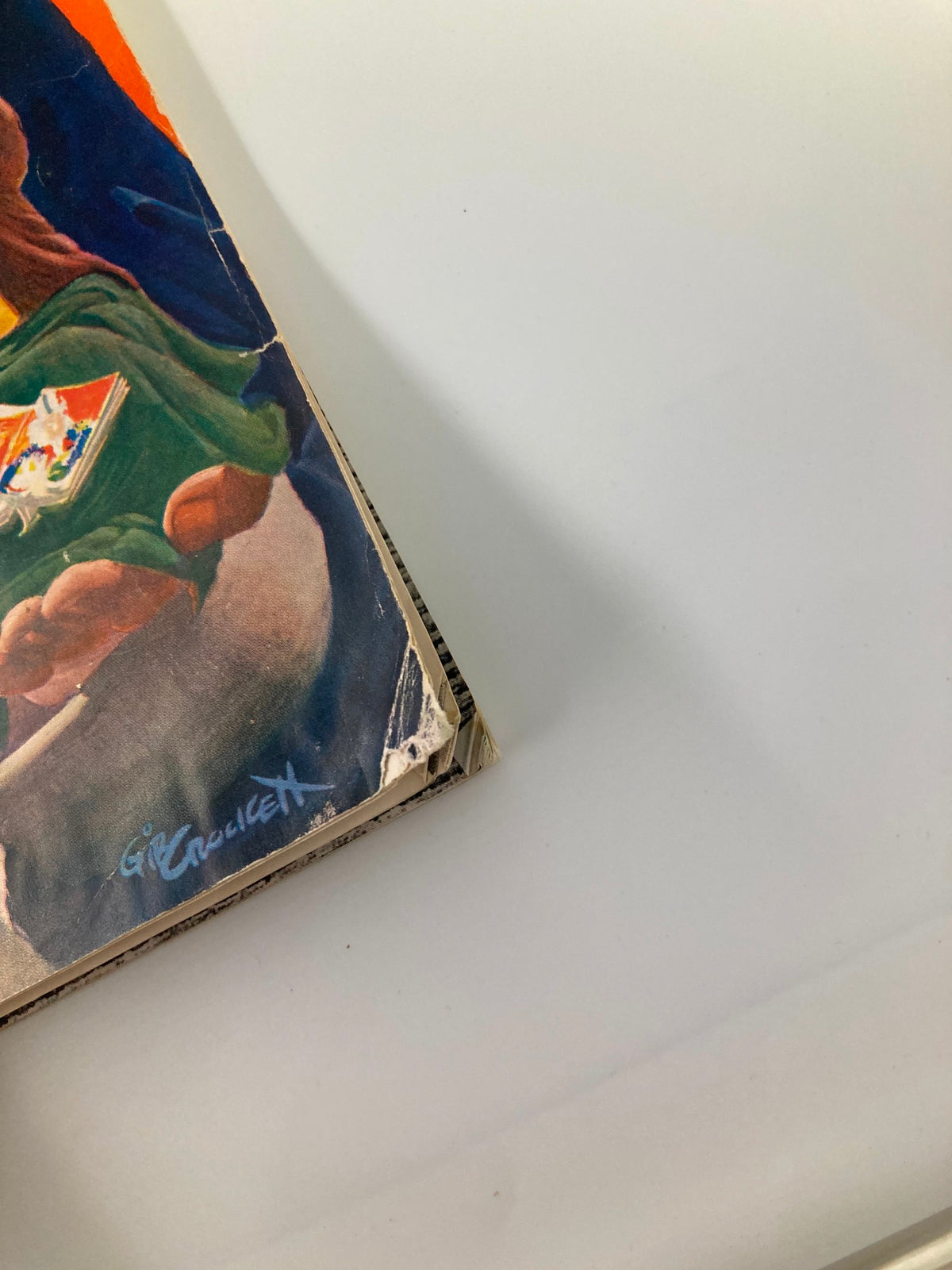 Side view of the 1940 NCAA Football Army vs Navy Official Program showcasing the artist's signature and binding details.