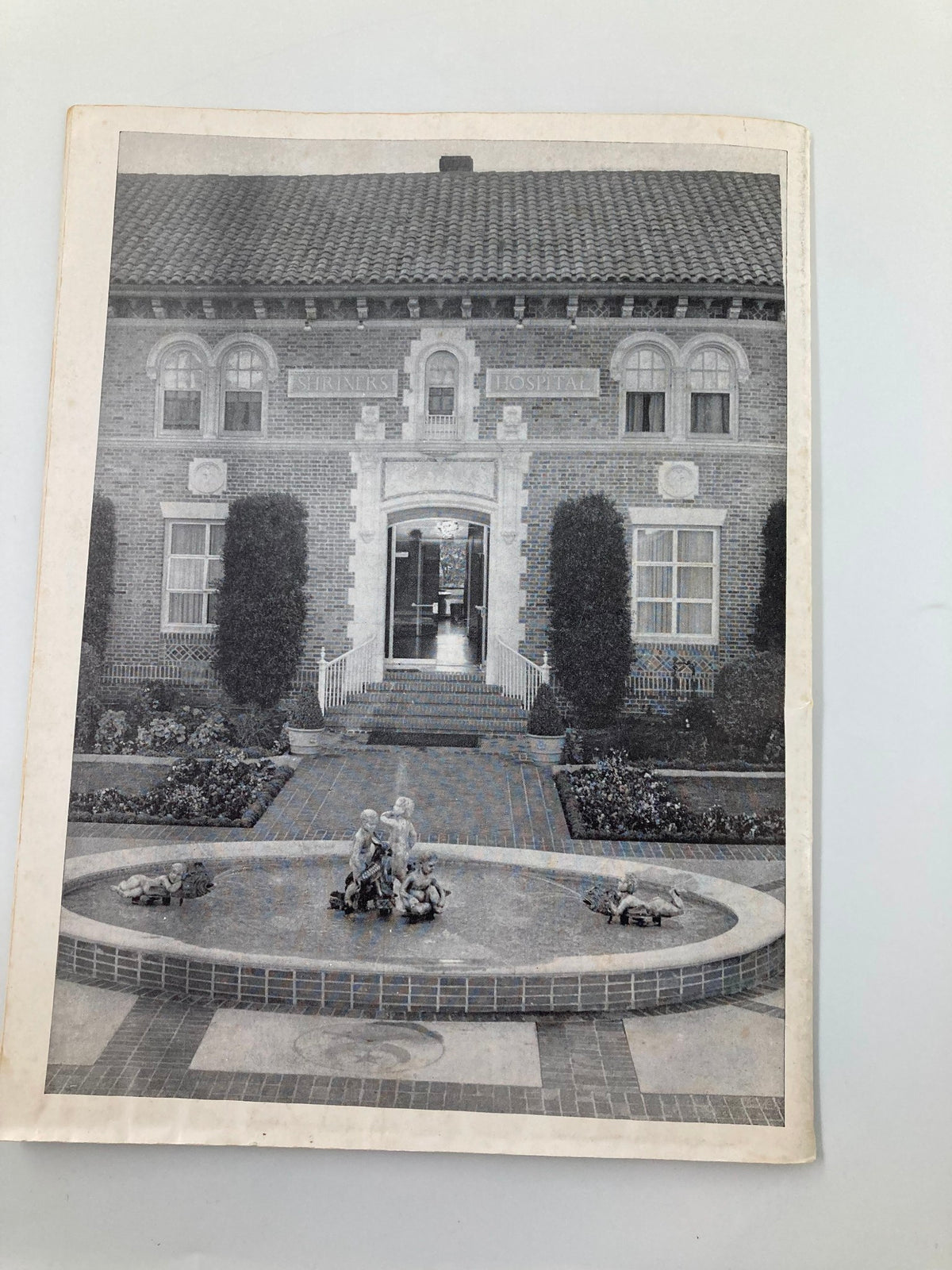 Exterior photograph of a historical building featured in the 1960 Islam Temple All-Star Football Game Official Program, highlighting architectural design.