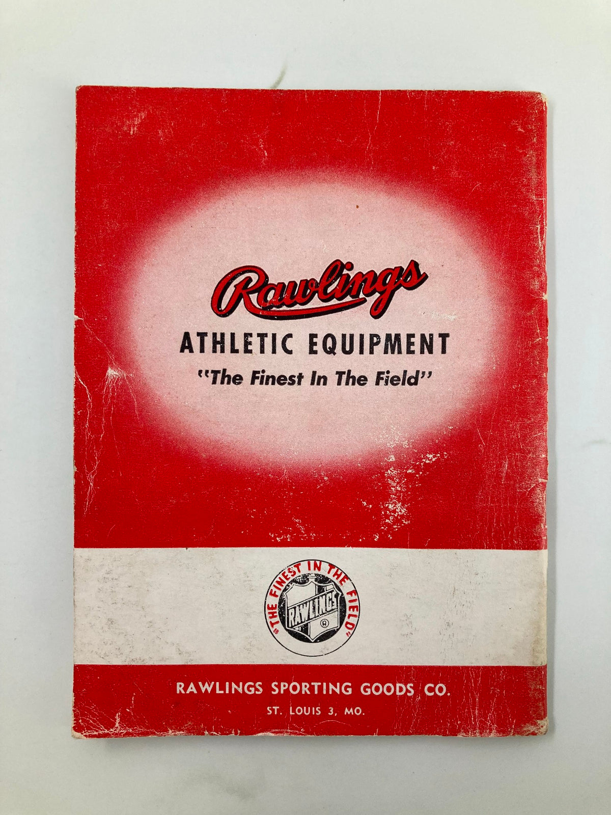 Cover of 'Rawlings Athletic Equipment', associated with '1946 Stan Musial's How The Majors Play Baseball by Bob Broeg', showcasing baseball gear from Rawlings.