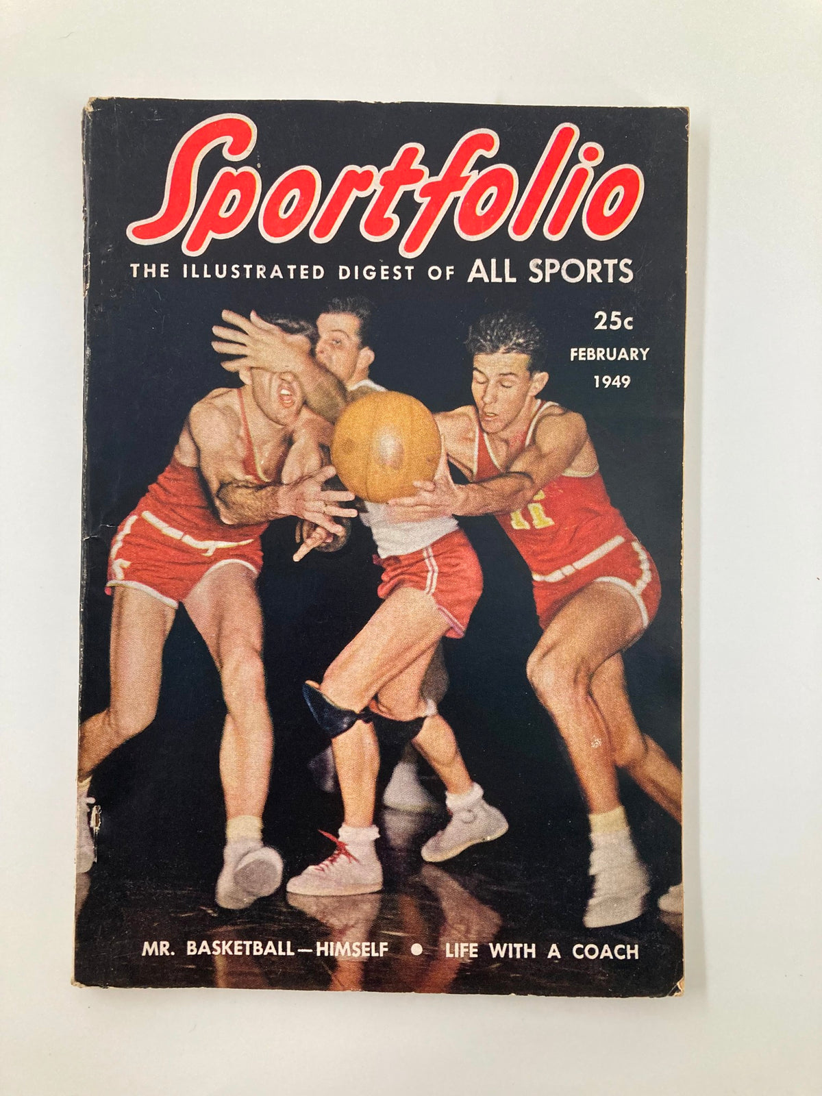 Cover of Sportsfolio Magazine February 1949 featuring basketball players in action, titled 'Mr. Basketball Himself: Life with a Coach'.