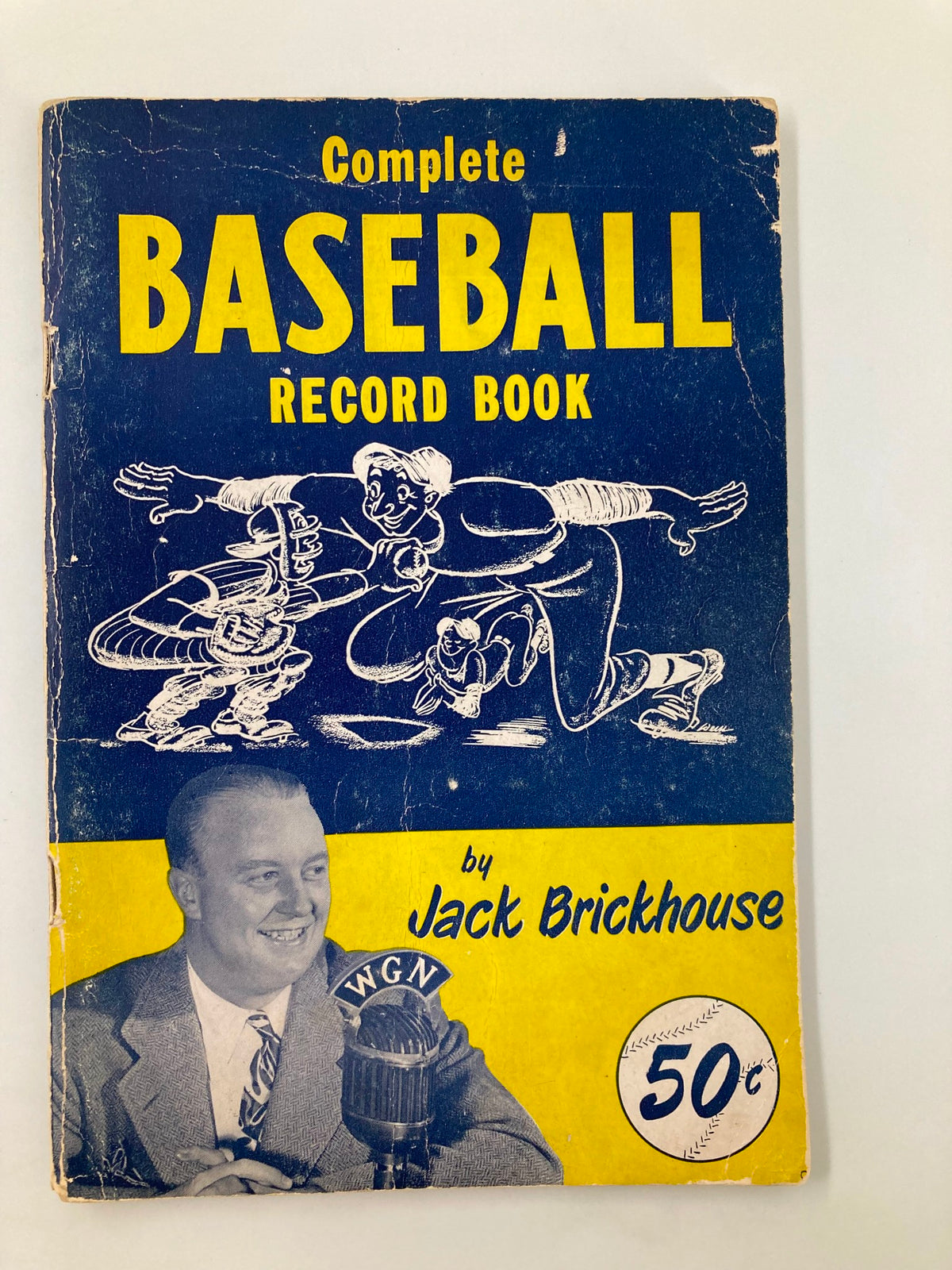 Cover of the 1950 Jack Brickhouse Complete Major League Baseball Record Book featuring a vintage design, showcasing illustrated baseball players and a microphone, indicative of its historical significance.