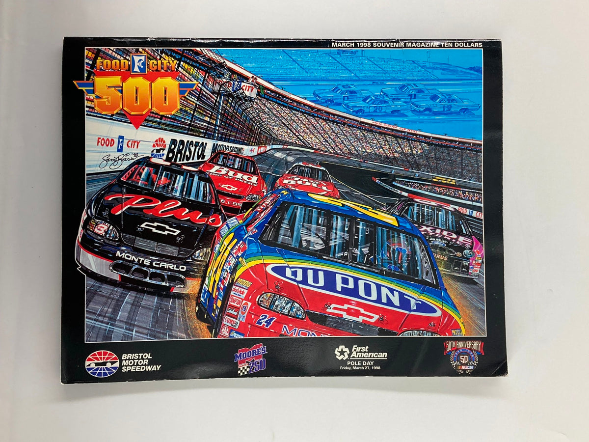 Cover of March 1998 Food City 500 Bristol Motor Speedway Souvenir Magazine featuring colorful artwork of NASCAR cars racing, highlighting the Bristol Motor Speedway.