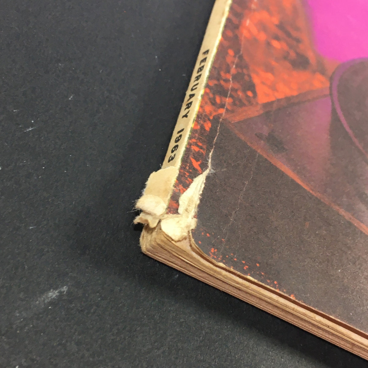 Close-up of the spine and edges of VTG High Fidelity Music Magazine February 1963, showing vintage wear.
