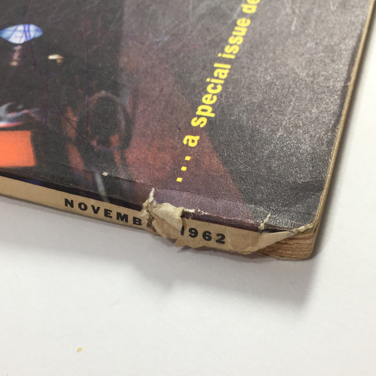Close-up of the bottom edge of the VTG High Fidelity Music Magazine November 1962, showing wear and the date November 1962, indicating its vintage character.