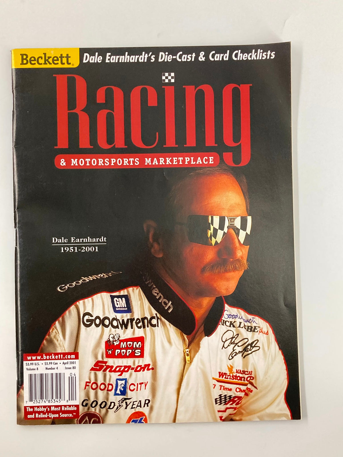 Cover of Beckett Racing & Motorsports Marketplace April 2001 featuring Dale Earnhardt, showcasing vintage racing memorabilia and collectibles.