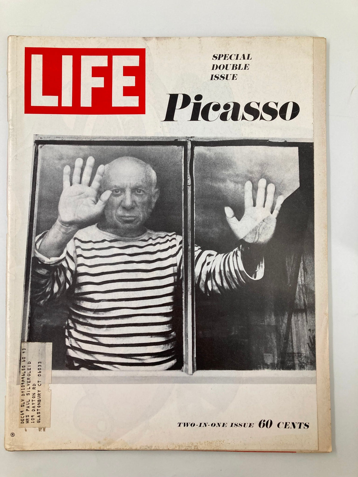 Cover of the vintage Life Magazine December 27, 1968 issue featuring Pablo Picasso, showcasing his artistic legacy with a striking black and white photograph of him behind a glass window, raising his hand.