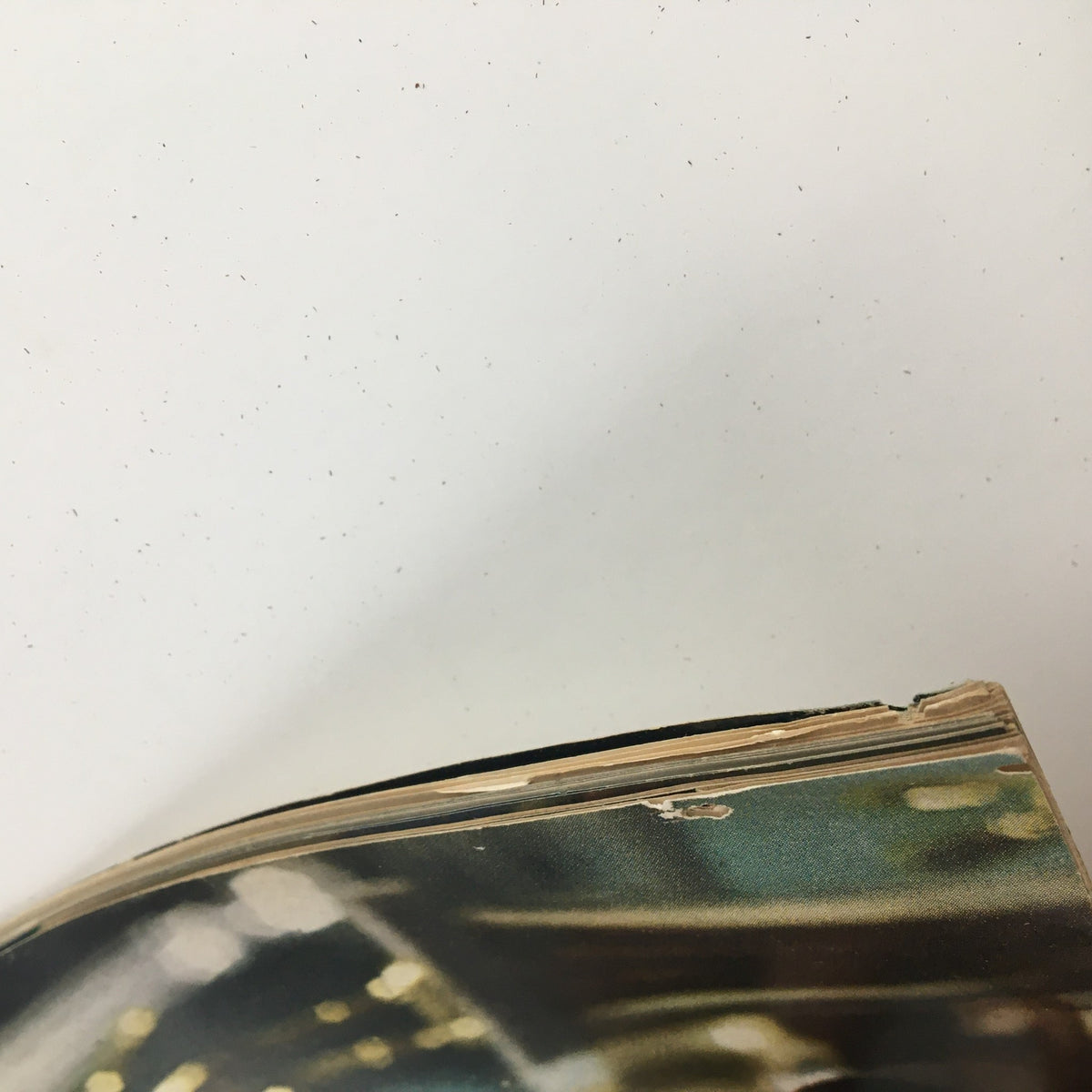 Close-up view of the spine of Sports Illustrated Magazine December 23 1968 Bill Russell Sportsman of the Year, showcasing signs of wear and vintage character.