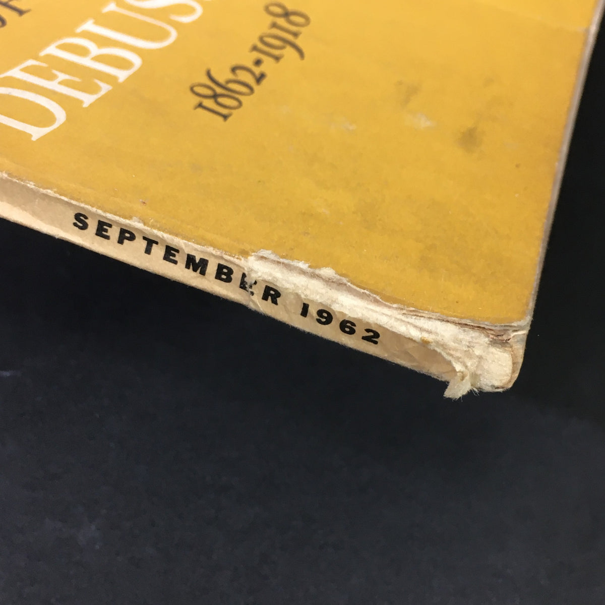 Close-up view of the spine of VTG High Fidelity Music Magazine from September 1962 featuring Claude Debussy, highlighting the month and year of publication.