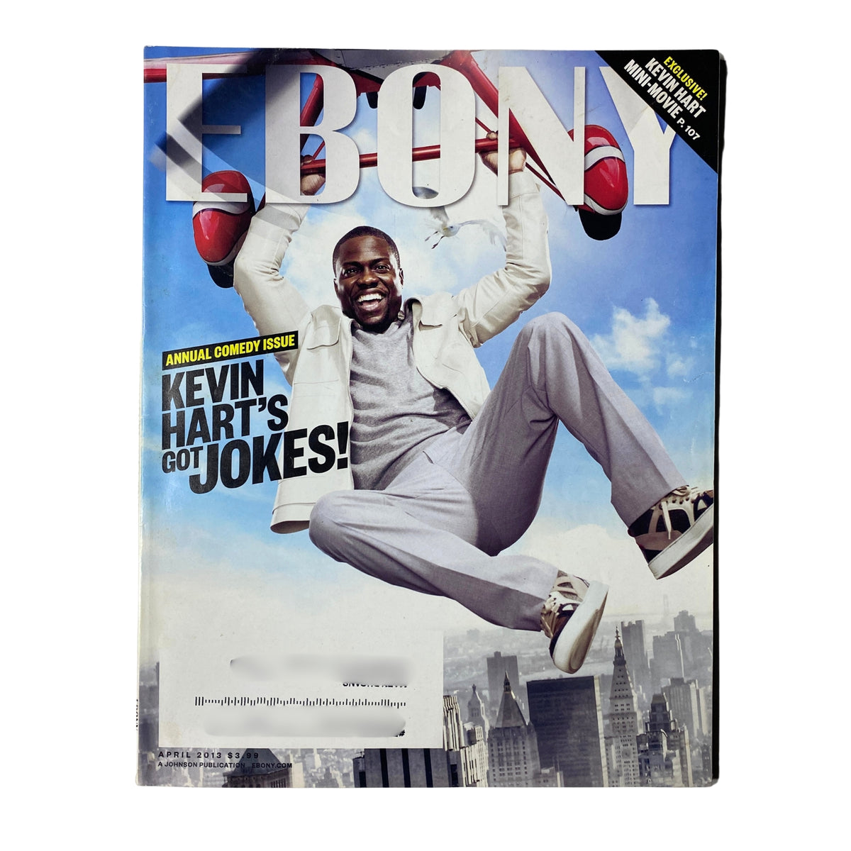 Ebony Magazine April 2013 Vol. LXVIII, No. 6 featuring Kevin Hart on the cover, showcasing the theme of comedy with Hart depicted in a playful pose against a city skyline.