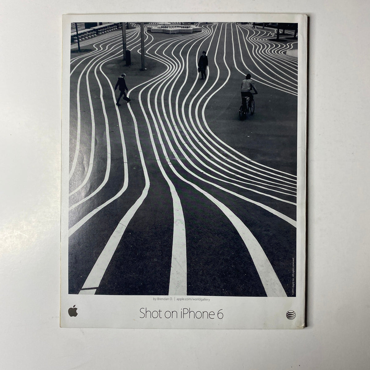 Advertisement for iPhone 6 with artistic street photography, featured in Ebony Magazine June 2015 Vol. LXX, No. 8.
