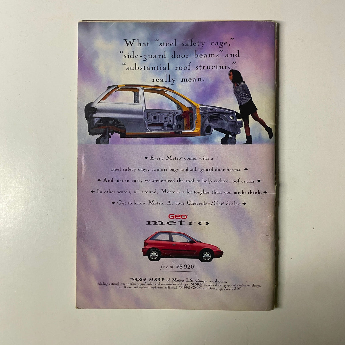 Advertisement for Geo Metro highlighting safety features such as steel safety cage, side-guard door beams, and roof structure in a vibrant, colorful layout. Featured in Jet Magazine November 4, 1996 – B.B. King Cover.