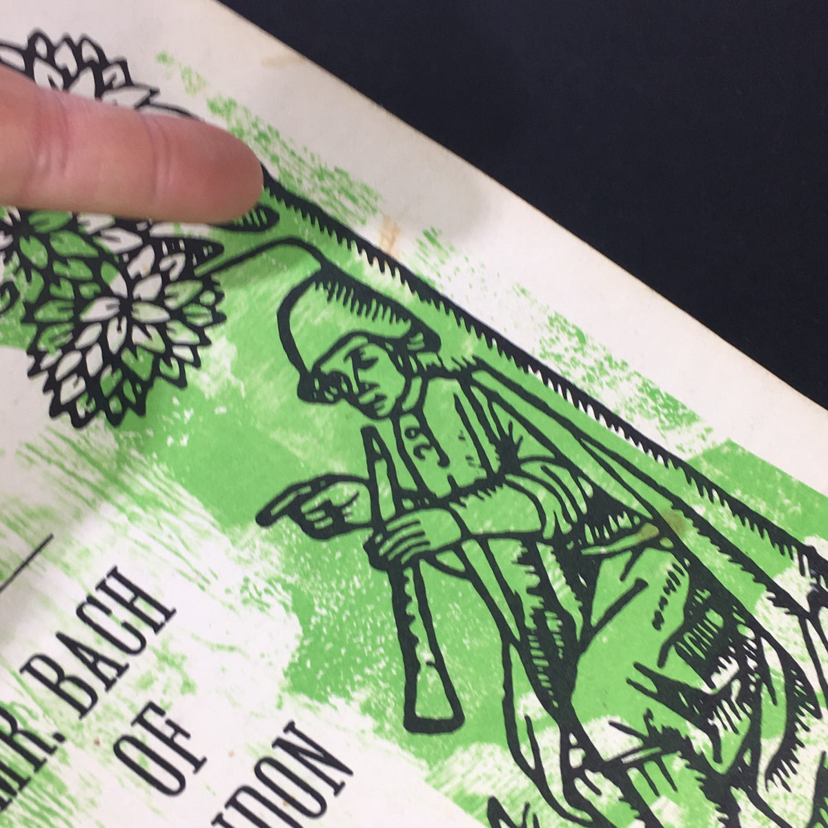 Detail shot of the cover of VTG High Fidelity Music Magazine June 1962, focusing on an illustration of a musician with a flute and greenery.