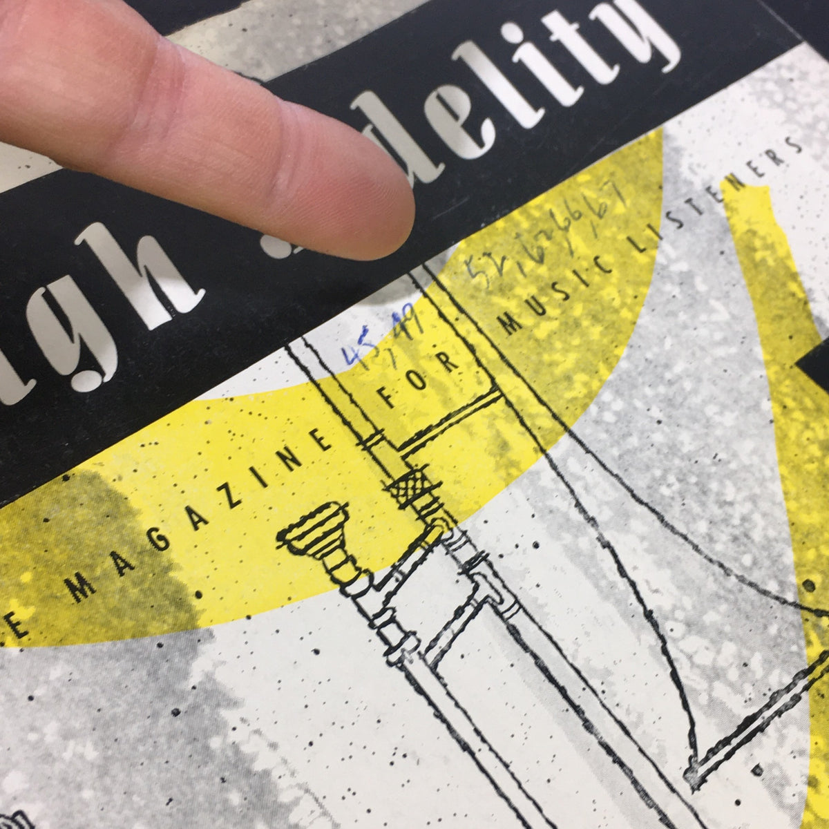 Close-up of the cover of VTG High Fidelity Music Magazine from July 1955, showing handwritten notes and artistic elements related to music.